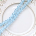 Macro shot of light blue crackle glass beads on a white textured ceramic dish for DIY jewelry - 1 Strand (Approx. 100-110 Beads) / Deep Blue