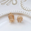 Macro detail of gold-plated filigree flower cap pendants for DIY jewelry making - Hollow Out Petal Crown Style (Size 6, Price per Piece)
