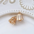Detailed macro view of hollow gold-plated bell pendant with white zircon inlays - Hollow Double-Sided Rhinestone Bell (9# Sold Individually)