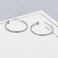 Macro detail of S925 sterling silver stamp on minimalist C-shaped hoop earrings - 25mm / White Gold