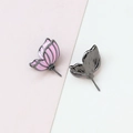 Detail of pink enamel butterfly earrings with gold plating and black metal backing - Single Piece / Gun Black (Left)