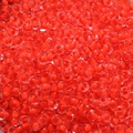 Macro shot of 4mm red transparent glass seed beads for DIY jewelry making accessories - Orange Red