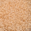 Macro detail of 4mm macaron apricot glass seed beads for DIY jewelry making - Lotus Root Color
