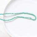 Mint green faceted crystal glass rice beads with iridescent AB finish for DIY jewelry - Cyan