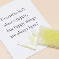 Detail of 3mm matte pale green seed beads in a plastic box for DIY jewelry making - Yellow