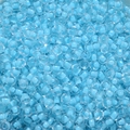 Macro view of 4mm light blue transparent glass seed beads with dyed core for DIY jewelry - Sky Blue