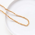 Faceted amber crystal glass rice beads in a golden finish for DIY jewelry making - Brown