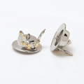 Close-up of steampunk silver top hat charms with golden gears and rabbit ears for DIY jewelry - White Gold