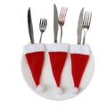 Drei Mini-Weihnachtsmützen als Besteckhalter mit Messer und Gabel auf einem weißen Teller - Aufgerauter Stoff Mini Weihnachtsmütze