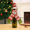 Festive knitted Christmas wine bottle cover with red plaid scarf and snowflake detail - Style B