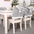 Grey Christmas chair covers with white pom-poms for festive dining room holiday decor - Grey Santa Hat Style