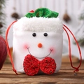 Charming snowman Christmas drawstring burlap gift bag with red bow on warm wood background - Snowman