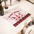 Christmas gnome placemats with Merry Christmas text and red plaid border on wood table - Red and Black Plaid Placemat