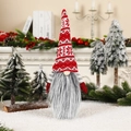 Close-up of a Christmas gnome bottle topper with a red knitted hat and long grey beard - Knitted Long Beard Style 4