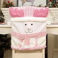 Pink reindeer Christmas chair cover with plush details and sequins in a home setting - Reindeer (Reindeer Chair Cover)