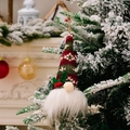 Knitted Christmas gnome ornament with snowflakes and LED lights on a snowy Christmas tree - Style E Glowing Small Pendant