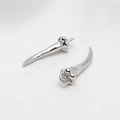 Macro shot of silver animal claw-shaped earrings on white silk fabric background - Silver Claw Print Horn Earring (9#)
