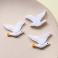 Detail view of cute resin white swan bird charms with yellow beaks for DIY crafts - Flying Seagull Style (1#)