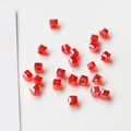 Macro shot of faceted red crystal cube beads for DIY jewelry making and earrings - Orange Red