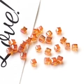 Macro shot of faceted amber crystal cube beads for DIY jewelry and earring making - 10# Gold Champagne
