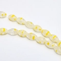 Macro detail of oval floral millefiori glass beads for DIY jewelry making - Approx. 32 Pcs/Strand (8x13mm) / Light Yellow