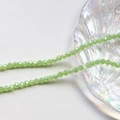 Macro shot of 4mm faceted light green crystal rondelle beads for jewelry making DIY - Spring Green (12#)