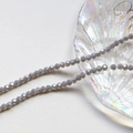 Macro detail of 4mm faceted grey crystal wheel beads for DIY jewelry making and crafts - Grey (13#)
