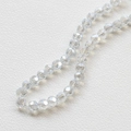 Macro shot of 4mm faceted clear crystal beads on white leather surface for DIY jewelry - Gray White (15#)