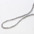 Macro shot of smoky grey AB coated faceted crystal wheel beads for DIY jewelry making - 1 Piece / Iridescent Gray