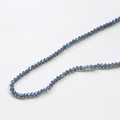 Macro detail of faceted dark blue rondelle glass beads for DIY jewelry making - 1 Piece / Blue Gray