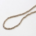 Macro view of smoky champagne faceted glass beads for DIY jewelry and necklaces - 1 Piece / Gold Champagne