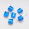 Macro detail of translucent blue square glass beads with inner silver foil texture - Ice Blue