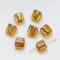 Macro shot of translucent amber glass square beads with gold foil inlay for DIY jewelry - Light Champagne