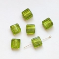 Detailed view of translucent green cube glass beads with gold foil foil inclusions - Light Green