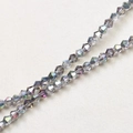 Macro view of 4mm faceted bicone crystal glass beads with dark grey AB rainbow coating - 1# Iridescent Gray