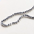Macro shot of 4mm faceted bicone beads with dark grey metallic finish for DIY jewelry making - 3# Silver