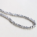 Macro view of 4mm faceted bicone crystal glass beads in metallic grey for DIY jewelry - 4# Silver White