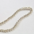 Macro shot of 4mm champagne faceted bicone crystal beads for DIY jewelry making - 9# Light Grey