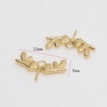 Detailed macro view of 22mm gold-plated antler bow jewelry charms for DIY accessories - Bow Antler Style / Gold