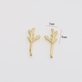 Macro shot of 7mm by 9mm gold-plated elk antler charms for DIY earring making - Small Antler Style / Gold