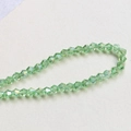 Close-up of 4mm faceted light green bicone crystal beads for DIY jewelry making - 12# Light Green