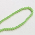 Macro detail of 4mm faceted light green crystal glass beads for DIY jewelry making - 14# Solid Green