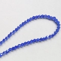 Close-up of 4mm faceted dark blue crystal glass spacer beads for DIY jewelry making - Royal Blue