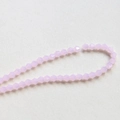 Macro shot of 4mm faceted lavender crystal bicone beads for DIY jewelry making - Light Pink