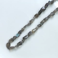 Detailed view of natural labradorite chips with blue flash effect for DIY jewelry making - 1 Piece / Labradorite