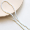 Detailed macro of 3mm faceted clear AB crystal rondelle beads for DIY jewelry making - 16# Bluish White