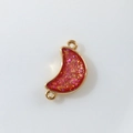 Macro view of red moon pendant with gold trim and glitter for DIY jewelry making - Water Red Moon (D1685)