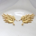 Detailed close-up of gold-plated metal wing jewelry components with realistic feather textures - Gold