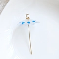 Macro view of transparent umbrella charm with blue heart patterns and golden metal hook - Royal Blue Heart Umbrella (Style 4)
