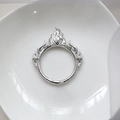 Detail view of silver flame ring with polished finish on a white ceramic tray - 2# Silver Flame Backrest / Silver